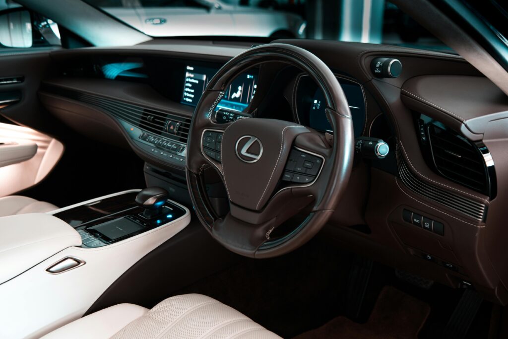 Explore the luxury and modern design of a Lexus car interior showcasing leather seats and high-end controls.